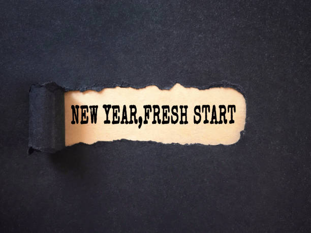 New year resolutions concept. ‘New Year, Fresh Start’ written on a ripped paper. Blurred styled background. 2019 new year resolution stock pictures, royalty-free photos & images