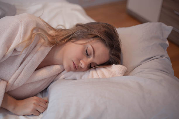 istock Woman asleep in bed. 1126375574