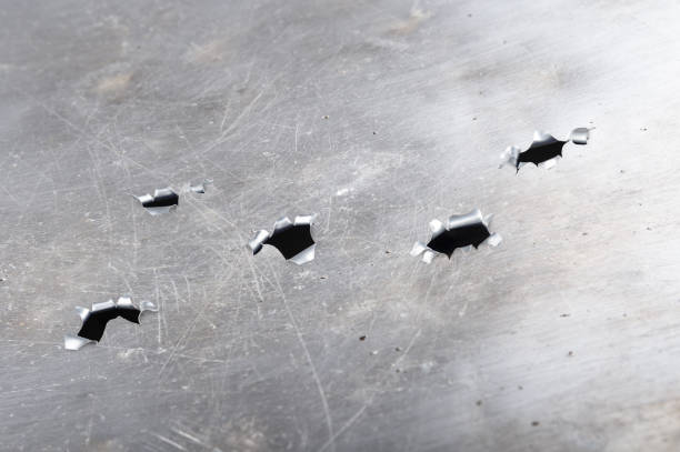 istock Grunge metal background with bullet holes 1126377167