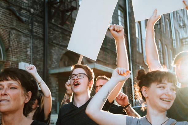 istock Happy protesters marching through the city 1126378728