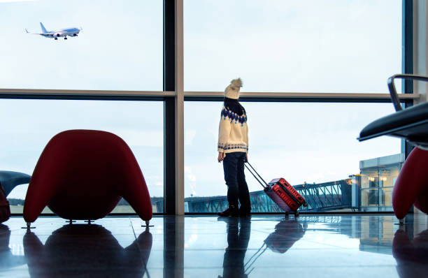 Girl waiting at the airport stock photo