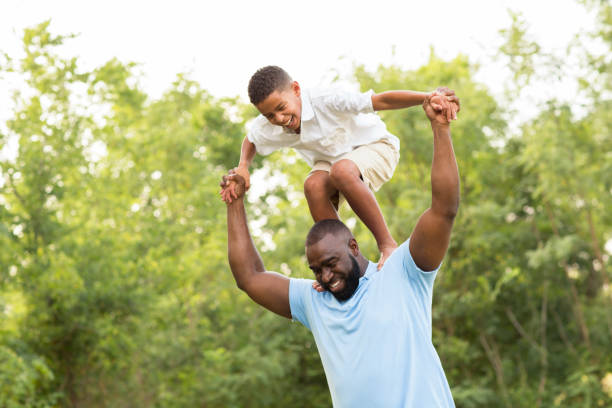 istock African American father and his son playing outside. 1126379595