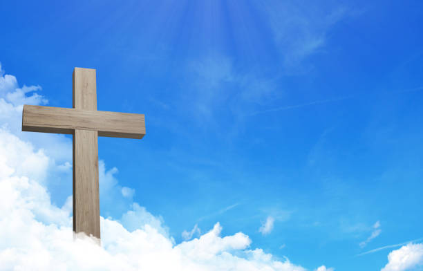 istock The cross of jesus and cloudful blue sky with copy space 1126379621