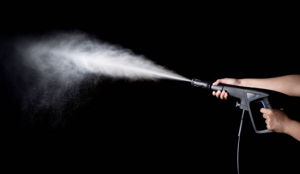 istock Water splashes with high pressure water jet on black background 1126380290