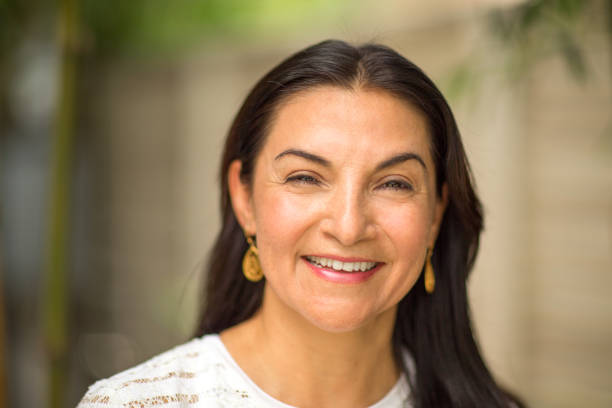 istock Happy Hispnaic woman smiling 1126380843