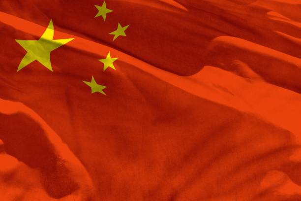 istock Waving China flag for using as texture or background, the flag is fluttering on the wind 1126381275