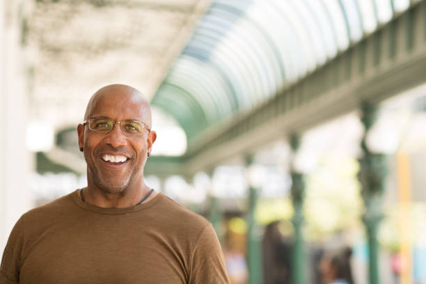 istock Mature African American man smiling wearing glasses. 1126381436