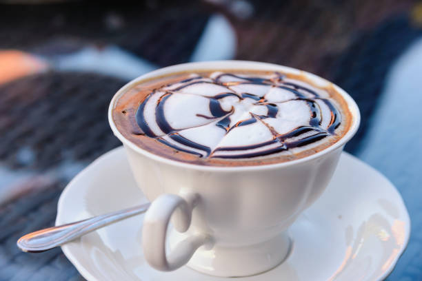 istock Relax time with hot cappuccino coffee in coffee cafe 1126383999