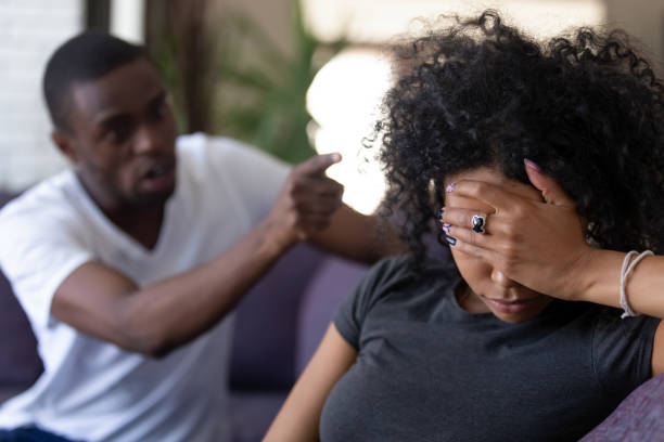 Tired african wife ignoring angry black husband blaming of problems Tired frustrated african wife ignoring angry black despot husband arguing blaming upset woman of problems, jealous man shouting at sad girlfriend, family fight and controlling boyfriend, disrespect dictator photos stock pictures, royalty-free photos & images