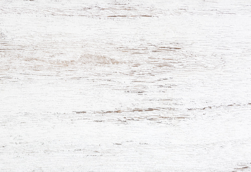 Grunge background. Peeling paint on an old wooden table. White wooden texture for background.  Top view.