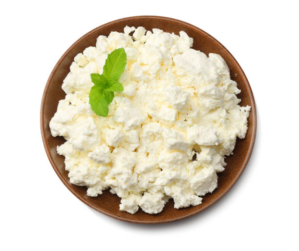 istock cottage cheese in brown bowl isolated on white background top view 1126386112