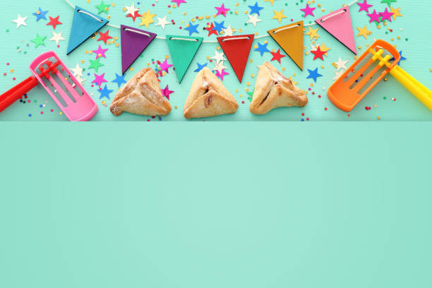 istock Purim celebration concept (jewish carnival holiday) over wooden mint background. 1126387427