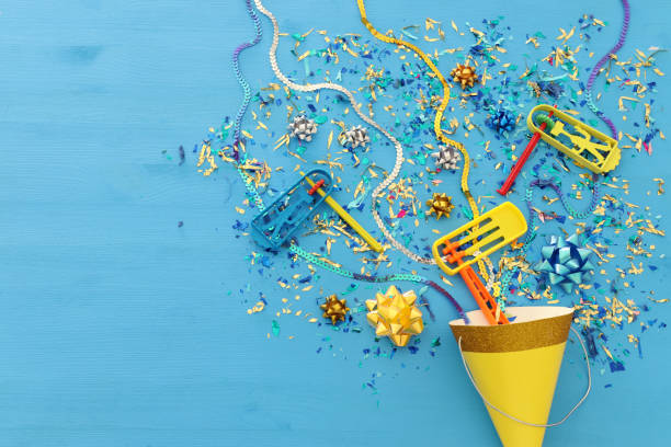 istock Purim celebration concept (jewish carnival holiday) over wooden blue background. 1126387467