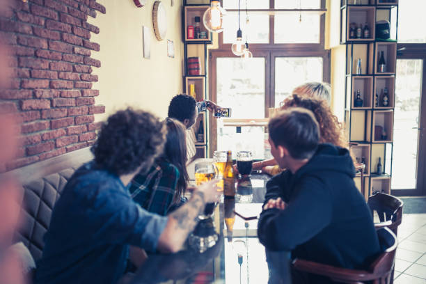 istock Group of the friends having fun in the pub 1126387668
