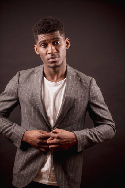 istock African american handsome businessman is buttoning his suit jacket 1126387886