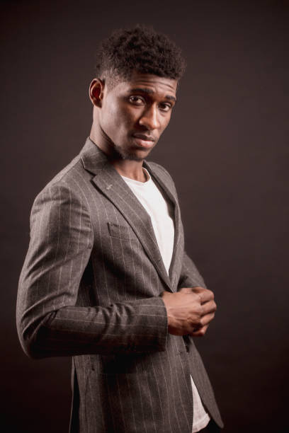 istock Afro male is putting on new suit jacket 1126388208