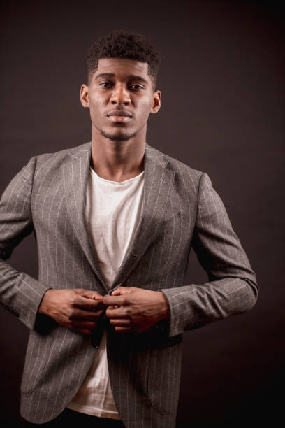 istock black man is putting on his suit. prepare for meeting 1126388602