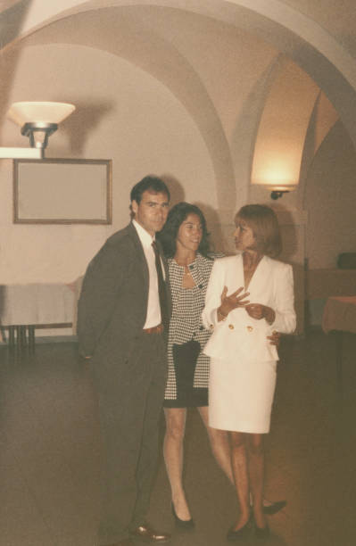 istock Three young people at a wedding party in 1968 1126390113