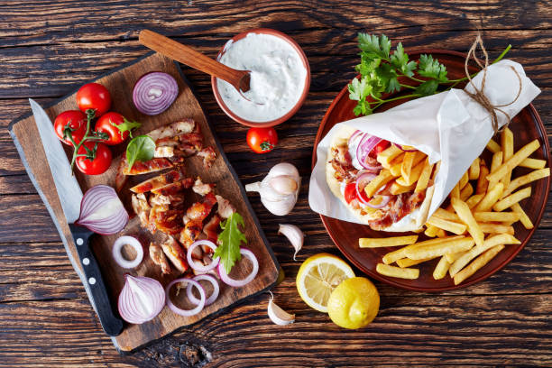 pita wrap with grilled shaved gyros meat - opa! souvlaki of greece imagens e fotografias de stock