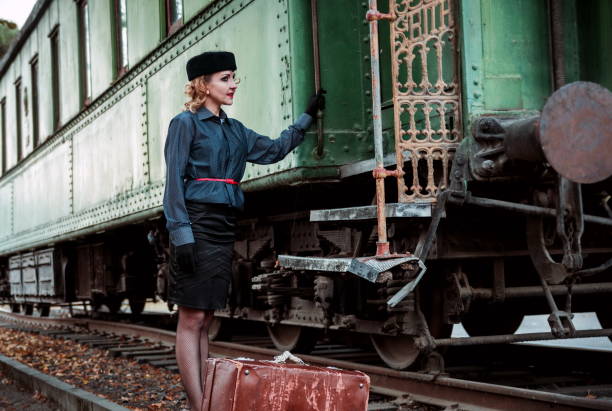 istock Woman Standing By Train 1126393408