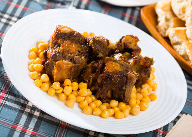 istock Braised oxtails with chickpeas on a white plate 1126394841