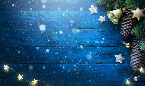 istock Christmas tree on blue wooden background 1126395141