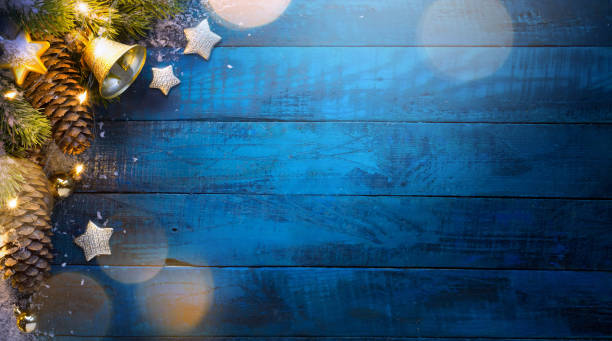 istock Christmas tree on blue wooden background 1126395212