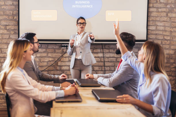istock Speaker giving public presentation using projector in conference room 1126395428