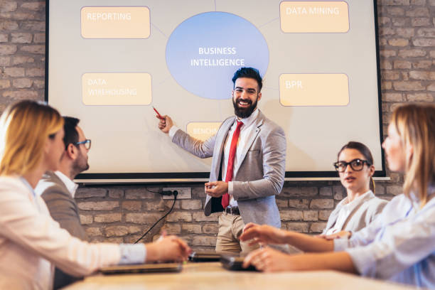 istock Speaker giving public presentation using projector in conference room 1126395540