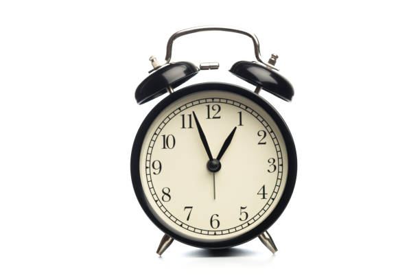 istock Black retro alarm clock on isolated background 1126396511