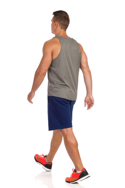 istock Walking Man In Sport Clothes. Rear Side View. 1126398060