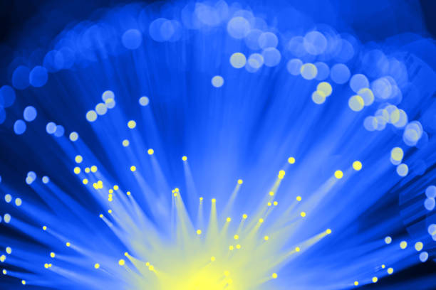 istock Fiber optics abstract background with defocused lights (blue) 1126398916