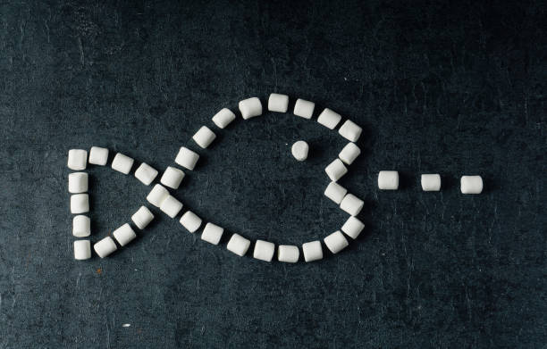 istock White Fluffy white marshmallows in black bowl isolated on black background. 1126400057