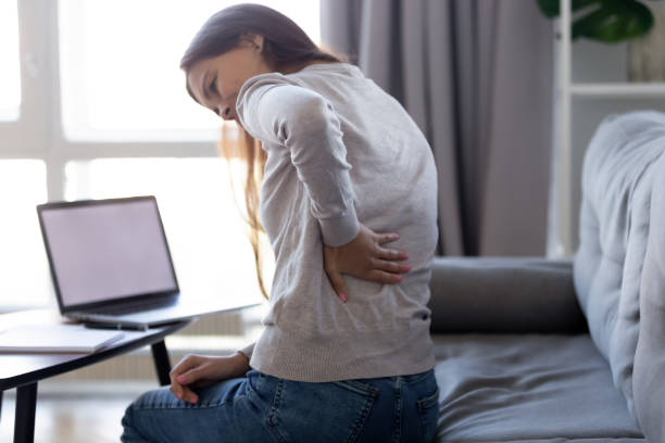 istock Young woman feeling backpain after sedentary computer work at home 1126400351