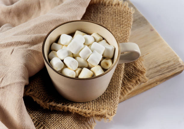 istock Mug of hot chocolate with candy marshmallows on table 1126401326