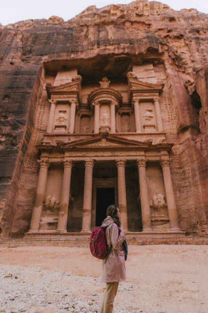 istock Woman looking at Al-Khazneh in Petra 1126404271