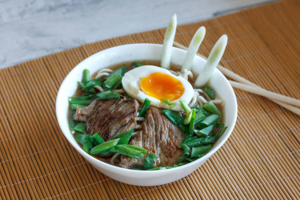 istock Ramen soup with fresh onions, boiled egg and fried meat 1126404545