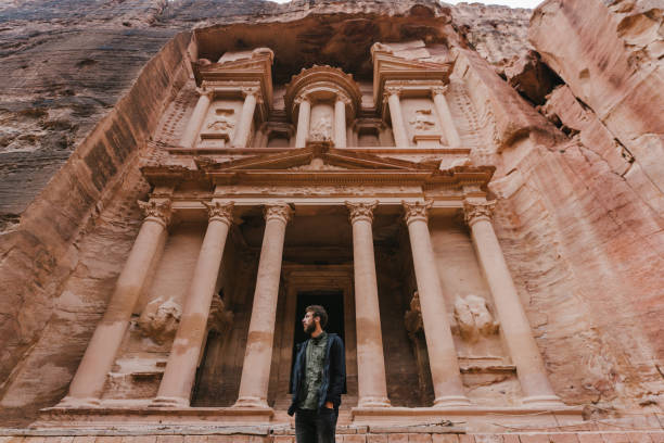 istock Man looking at Al-Khazneh in Petra 1126407003