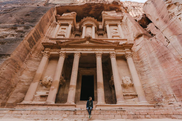 istock Man looking at Al-Khazneh in Petra 1126407076