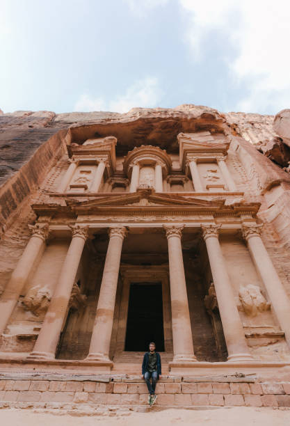 istock Man looking at Al-Khazneh in Petra 1126407100