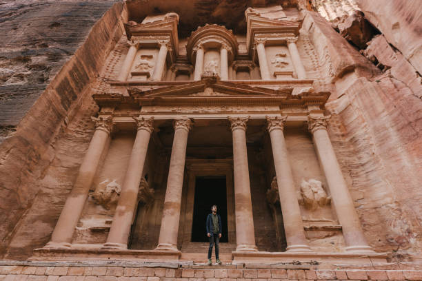 istock Man looking at Al-Khazneh in Petra 1126407699