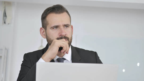 istock Pensive Businessman Thinking New Idea at Work 1126408797