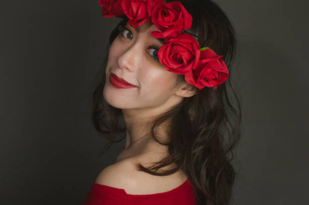 istock Asian woman wearing red roses crown 1126409472