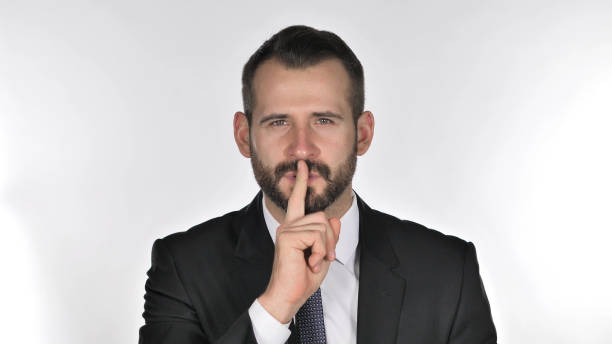 istock Portrait of Beard Businessman Gesturing  Silence, Finger on Lips 1126411471