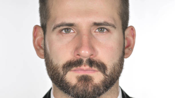 istock Close Up of Serious Beard Businessman Face, White Background 1126411581