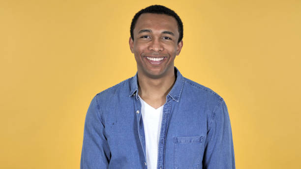 istock Smiling Young African Man Isolated on Yellow Background 1126412189