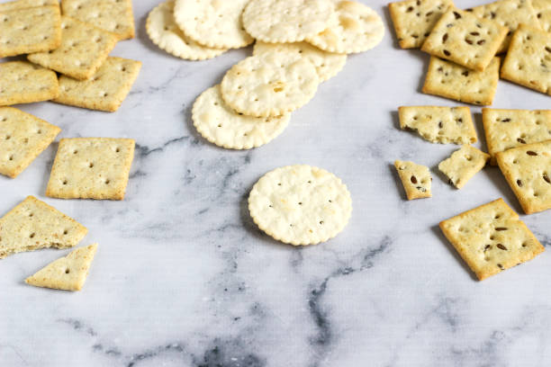 istock Matzo crackers, salty crackers with sesame seeds and flax seeds on a light background. 1126412254