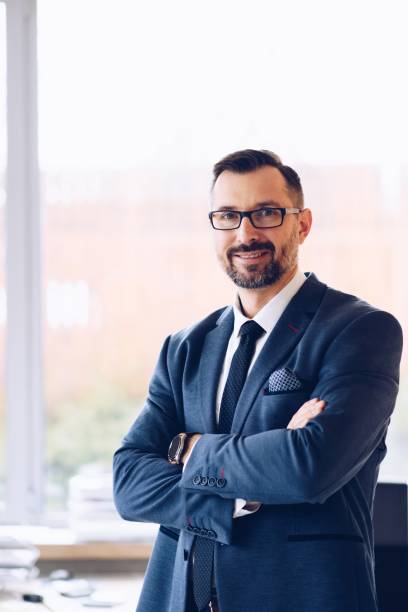 istock 40 years old handsome businessman in suit at office 1126412315