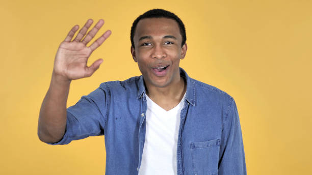 istock Video Chat by African Man Isolated on Yellow Background, Talking 1126412468