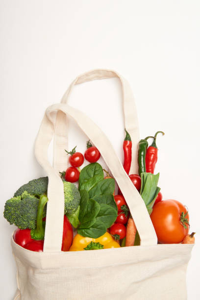 istock Studio shot of eco bag with vegetables on white background 1126412623